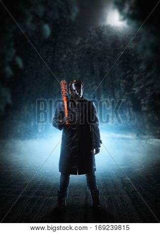 Evil embodiment in hockey mask and leather coat