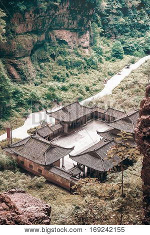 Antique Chinese historical tavern in the woods with vintage color tone and without people Wulong National Park Chongqing China