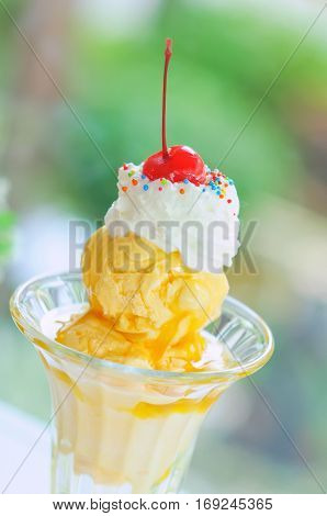 Banana Sundae with wipping cream and cherry
