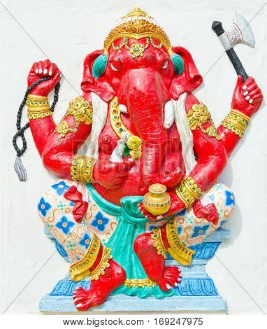 God of success 27 of 32 posture. Indian style or Hindu God Ganesha avatar image in stucco low relief technique with vivid colorWat Samarn ChachoengsaoThailand.