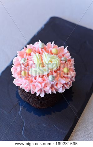 Closeup pink cupcake with number sixteen on top