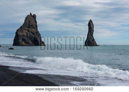 Reynisdrandar basalt sea stack near the village Vik i Myrdal