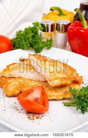 Juicy chicken fillet in beer batter with herbs and spices