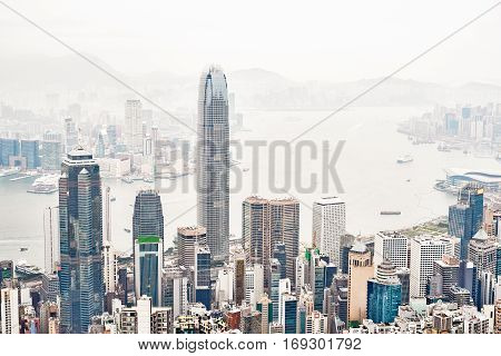 Business concept for real estate and corporate construction - panoramic modern city skyline bird eye aerial view with morning grey sky in Hong Kong (HK) China