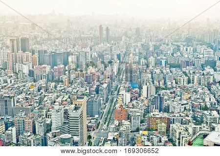 Business concept for real estate and corporate construction : panoramic modern city bird eye view with dramatic sunrise and morning blue sky from 101 building in Taipei Taiwan