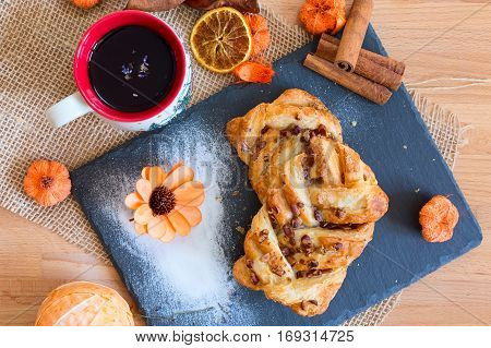 marple and pecan plait pastry sweet food breakfast with tea cup and flower