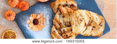 marple and pecan plait pastry sweet food breakfast with flower banner background