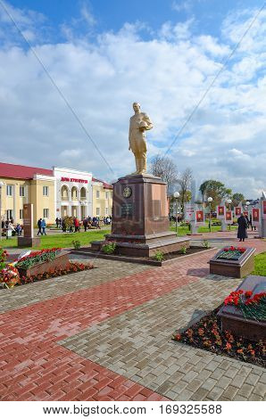 SENNO BELARUS - OCTOBER 8 2016: Unidentified people walk on Alley of Heroes and near House of Culture in Senno Vitebsk region Belarus