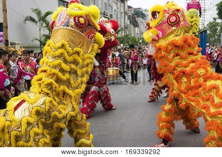 Hanoi, Vietnam - Sept 8, 2014: A show of dragon and lion dance performed at lunar mid autumn festival at Times City Complex. This is a form of traditional dance and performance in Vietnamese culture