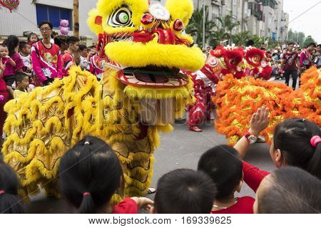 Hanoi, Vietnam - Sept 8, 2014: A show of dragon and lion dance performed at lunar mid autumn festival at Times City Complex. This is a form of traditional dance and performance in Vietnamese culture
