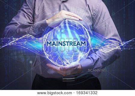 Business, Technology, Internet And Network Concept. Young Businessman Shows The Word: Mainstream