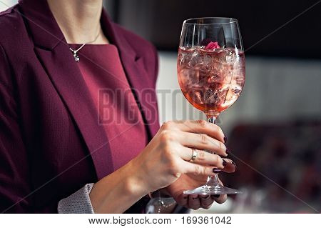 Freshness every day. Glass of very cold water in girl's hand transparent glass. Quench their thirst.