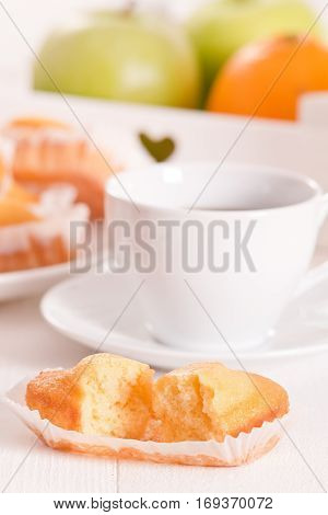 Breakfast with plumcake cup coffee on white dish.