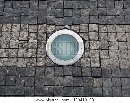 Roung Light In A Cobble Stone Pavement