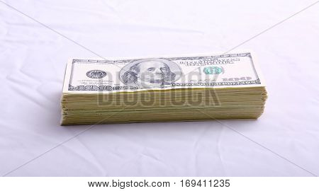 Stacks of American money isolated on white with room for your text. Serial Numbers removed. Fat Stacks of Cold Hard Cash. 