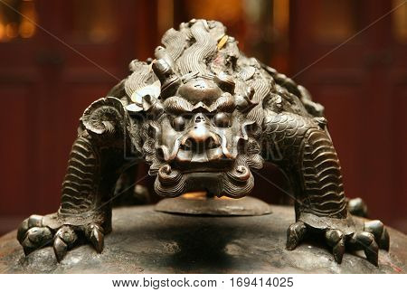 bronze figure of chinese mythological beast closeup