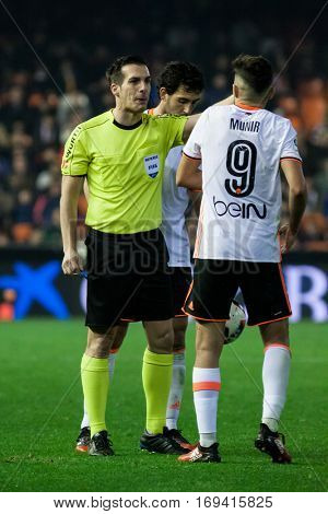 VALENCIA, SPAIN - JANUARY 3: Referee talks with Munir during King Cup soccer match between Valencia CF and Celta de Vigo at Mestalla Stadium on January 3, 2017 in Valencia, Spain