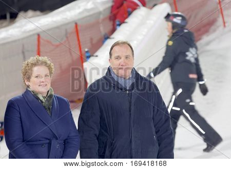 STOCKHOLM SWEDEN - JAN 31 2017: Smiling Swedish Prime Minister Stefan Loeven and Swedish Prime Minister Stefan Loeven and Finance Commissioner Karin Wanngard responisble for the prize ceremonie in the parallel slalom downhill alpine skiing event Audi FIS