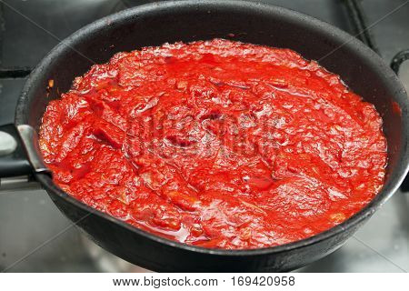 Beautiful red tomato paste closeup. Background with tomato sauce
