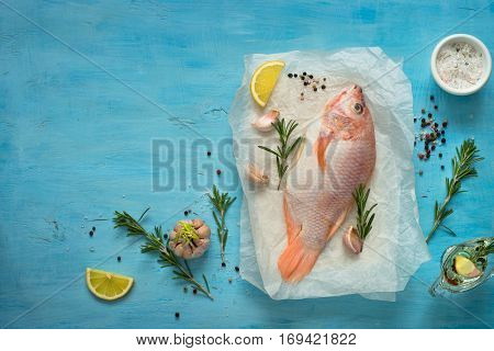 Fresh raw fish tilapia. Nile tiapia Oreochromis niloticus. Top view. Food cooking background.