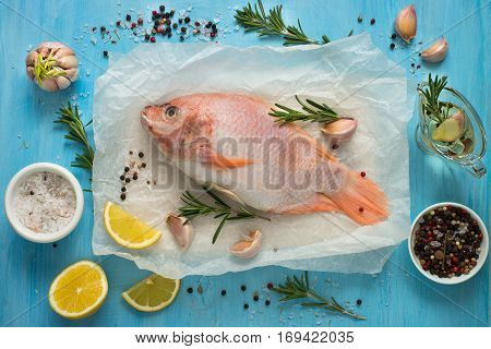 Fresh raw fish tilapia. Nile tiapia Oreochromis niloticus. Top view. Food cooking background.