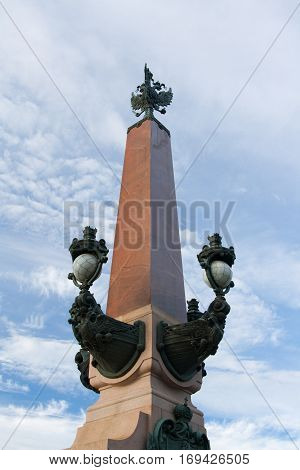 The obelisk at the entrance to the Trinity Bridge. Saint Petersburg Russia.