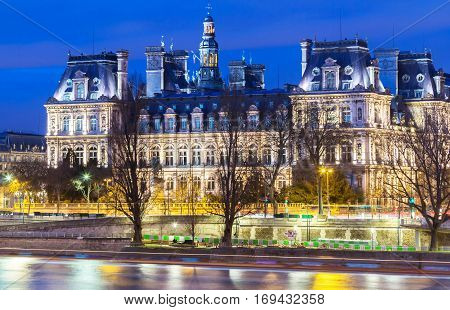 City Hall in Paris at night - building housing City of Paris administration. Building was constructed between 1874 -1882, architects Theodore Ballou and Edouard Deperta. France