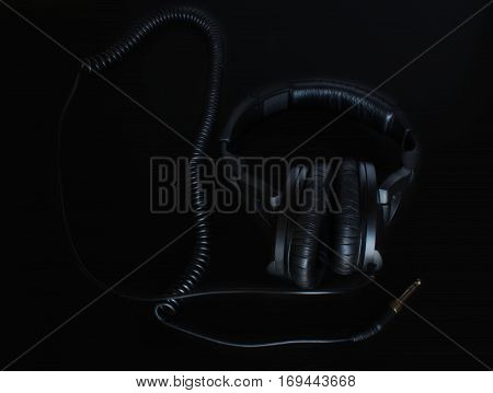 big black headphones on the black background