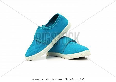 Blue slip on shoes isolated on white
