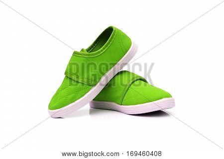 Green slip on shoes isolated on white