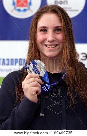 ST. PETERSBURG, RUSSIA - DECEMBER 17, 2016: Silver medalist in women 400 m freestyle swimming Anastasiia Kirpichnikova in medal ceremony of X Vladimir Salnikov Cup