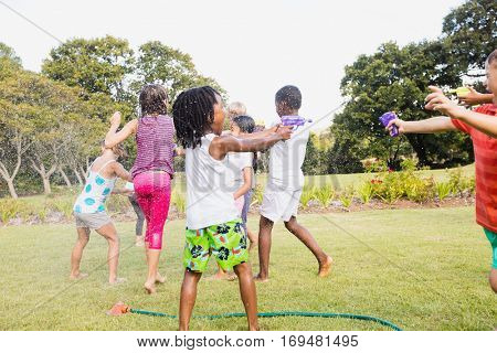 Kids playing together during a sunny day at park