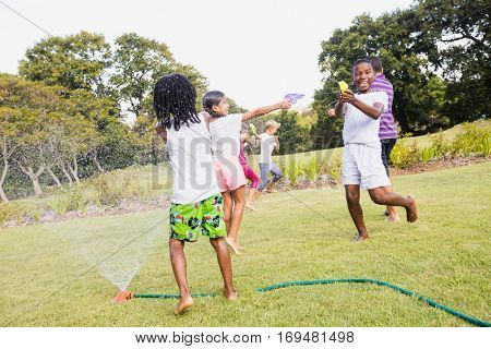 Kids playing together during a sunny day at park