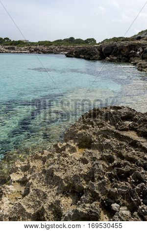 Touristic, Rocks by the Mediterranean sea on the island of Ibiza in Spain, holiday and summer scene