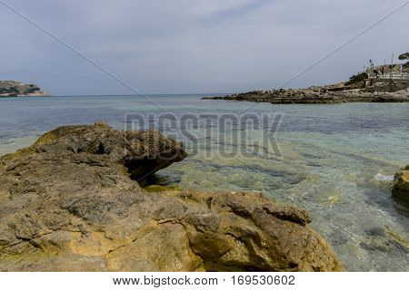Rocks by the Mediterranean sea on the island of Ibiza in Spain, holiday and summer scene
