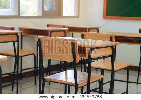 School classroom with desks wood chalkboard whiteboard in high school thailand