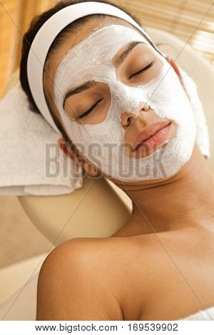 Close-up of young woman wearing facial mask