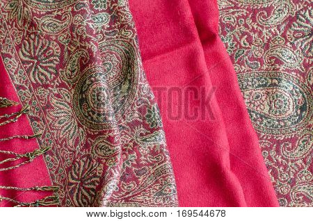 Texture of cashmere pashmina textile red and golden colors