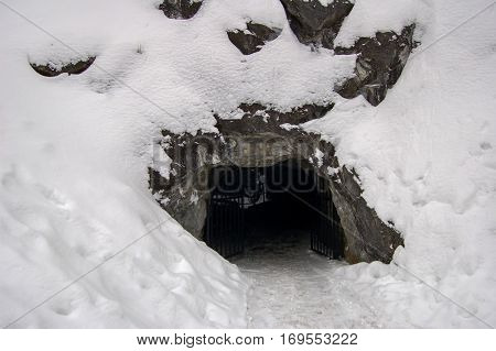 Cave in the snow outdoors