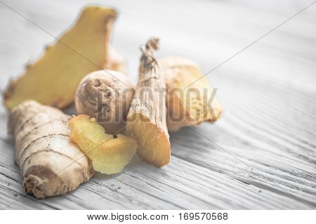 Ginger On Wooden Background