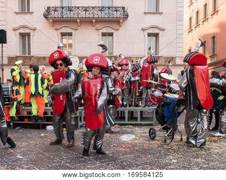Lugano Switzerland - february 12 2015: Carnival Lugano Ul Sbroja Guggenmusic Fracassband and Spacatimpan sounds in the town hall square and the streets in celebration.
