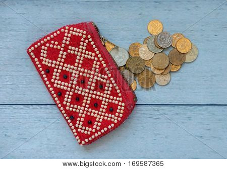 red old rag purse and copper coins on the table