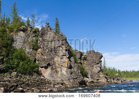 Fantastical cliffs on the river. Eastern Siberia. Krasnoyarsk Territory