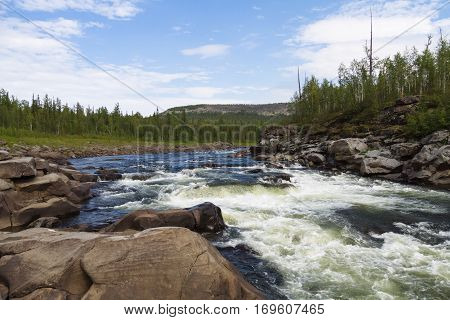 Fantastical cliffs and rapids on the river. Eastern Siberia. Krasnoyarsk territory