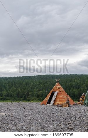 Wigwam of birch bark on the island. Bahta river, Siberia