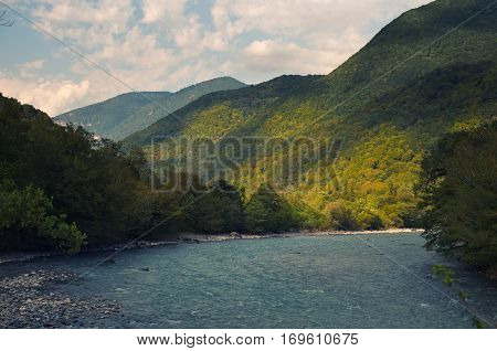 River in the mountains, originating in the high mountain lake.