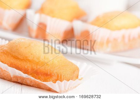 Breakfast with mini plumcake on white dish.