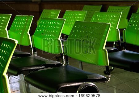 the group of chairs with green backrest and back light.