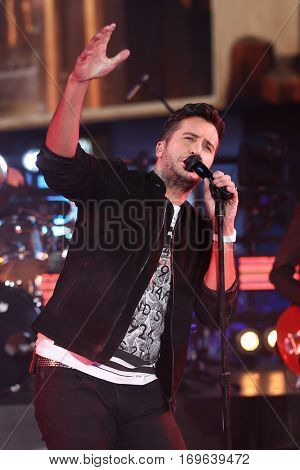 NEW YORK-DEC 31: Recording artist Luke Bryan performs onstage during Dick Clark's New Year's Rockin' Eve at Times Square on December 31, 2015 in New York City.