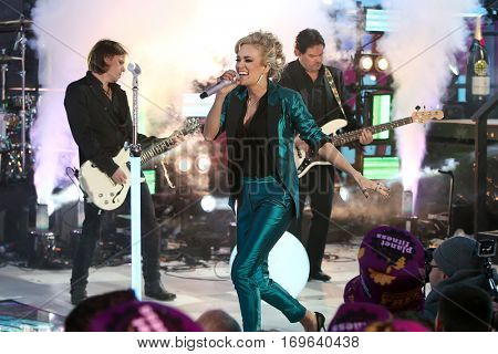 NEW YORK-DEC 31: Recording artist Carrie Underwood onstage during Dick Clark's New Year's Rockin' Eve at Times Square on December 31, 2015 in New York City.
